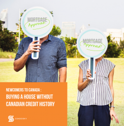 Man and woman holding up mortgage approved signs